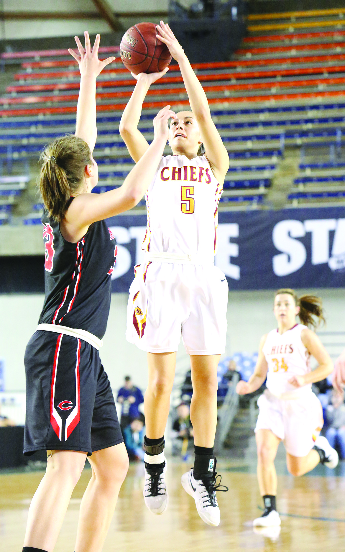 Connor Vanderweyst/Columbia Basin Herald
Moses Lake guard Jamie Loera pulls up for a shot against Camas.