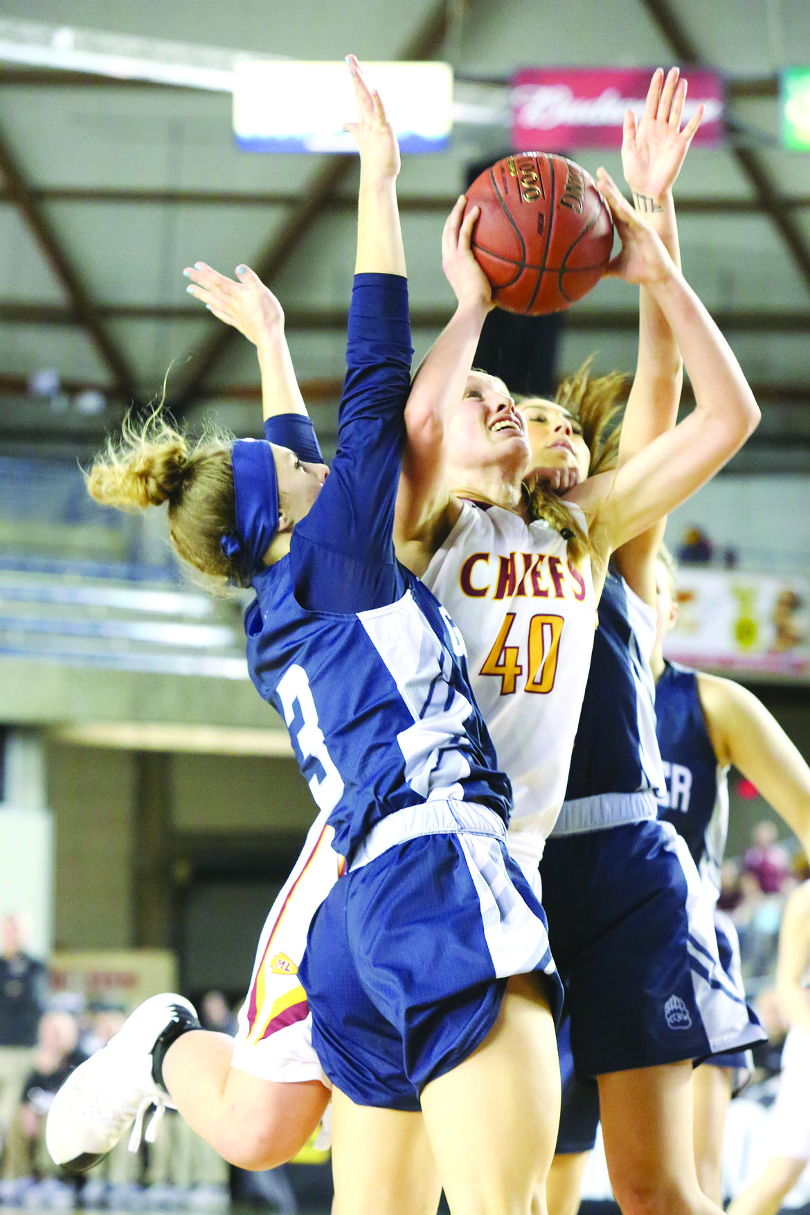 Connor Vanderweyst/Columbia Basin Herald
Moses Lake's Abby Rathbun (40) goes up for a lay-up between two Glacier Peak defenders.