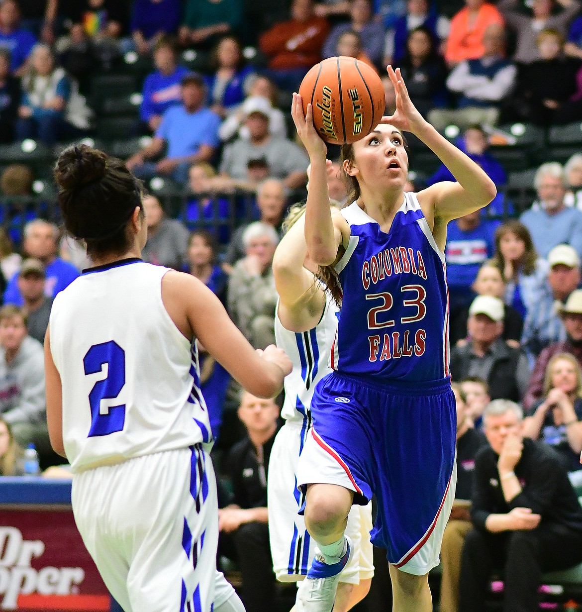 Wildkat Peyton Kehr takes a shot against Havre's Ceyara Plante in the state A semifinal game in Butte Friday. (Chris Peterson photo)