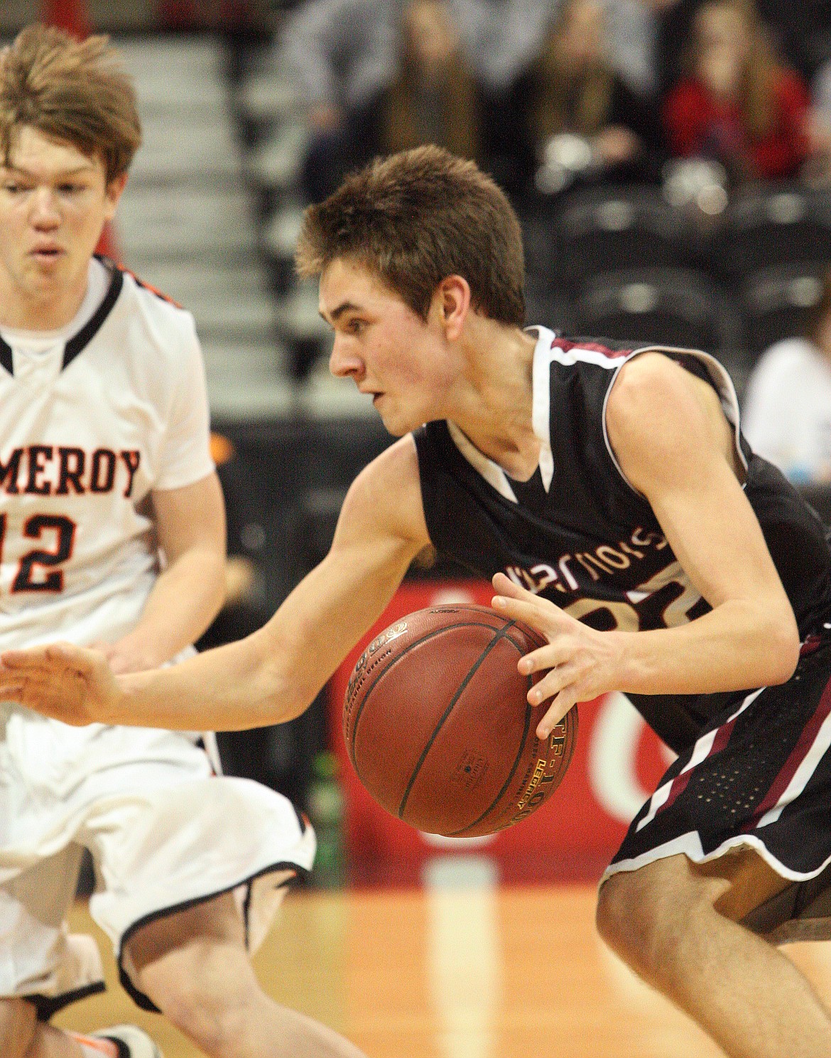 Rodney Harwood/Columbia Basin HeraldAlmira/Hartline-Coulee sophomore Maguire Isaak drives the lane against Ryan Wolf of Pomeroy during Saturday's double ovetime win in the 1B state third-place game at the Spokane Veterans Memorial Arena.