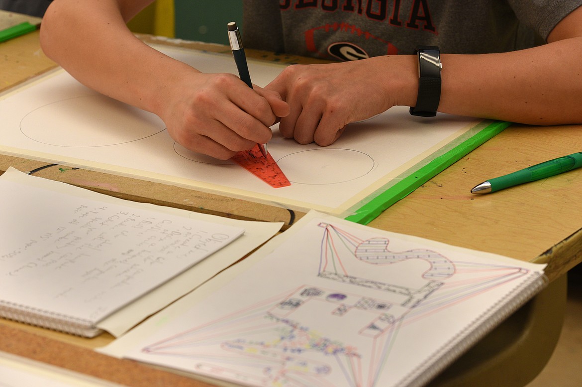 A Kalispell Middle School eighth-grader works on a STEAM project at the school on Wednesday.