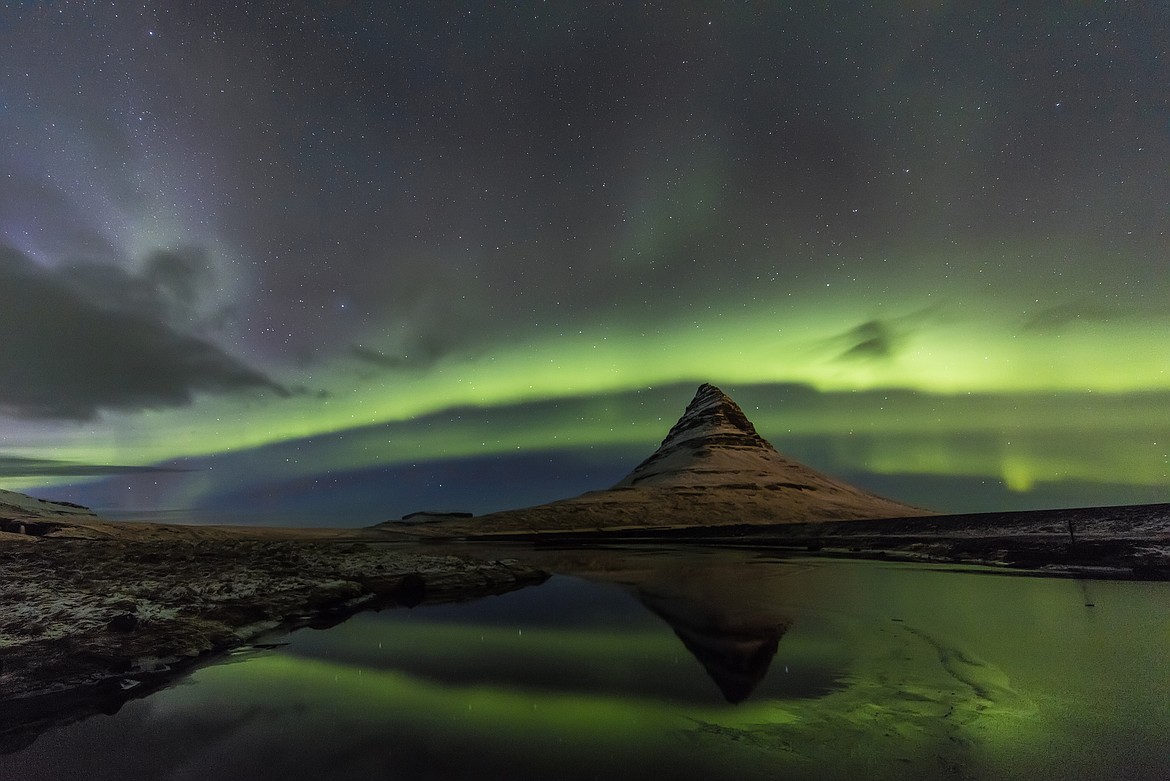 Aurora borealis reflects below Kirkjufell aka Church Mountain on the Snaefellsnes Peninsula in western Iceland (Chuck Haney photo)