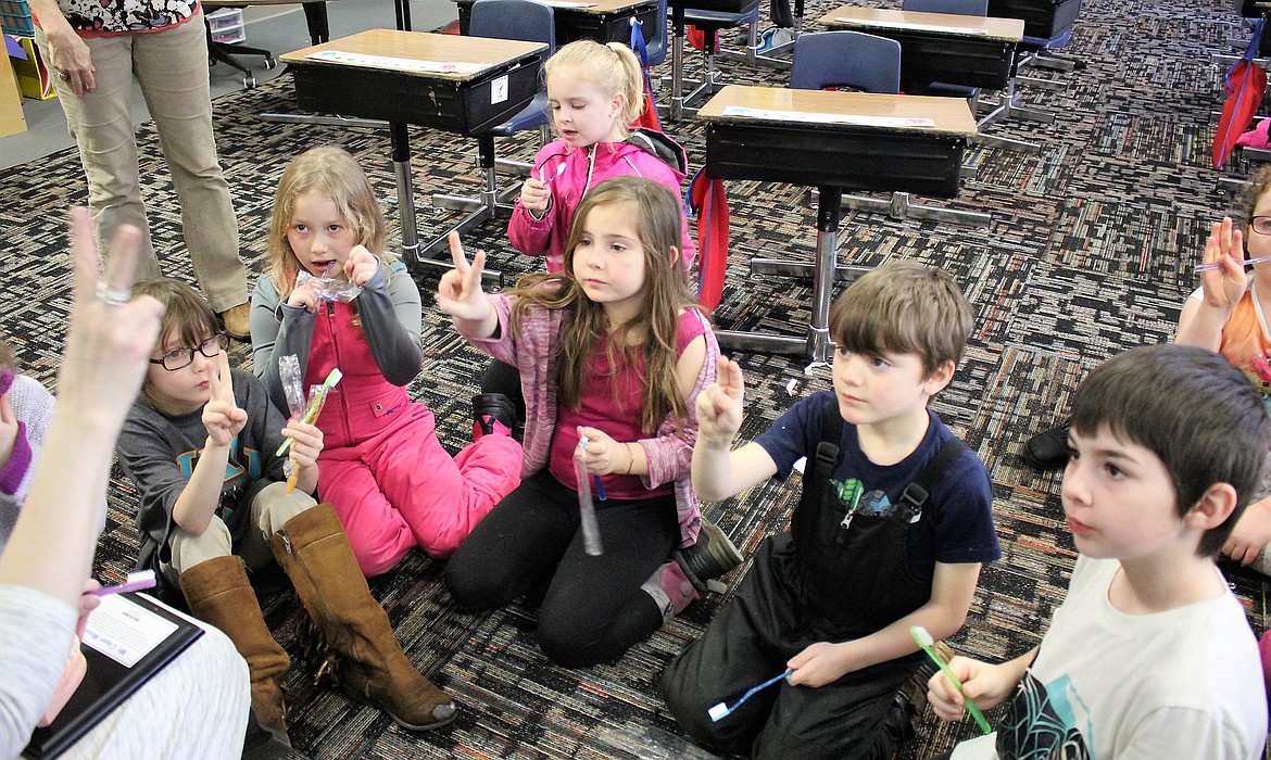 Superior School nurse Barb Jasper teaches the Mrs. Cooper&#146;s first-grade class about brushing for two minutes, twice a day for good oral health care. (Kathleen Woodford/Mineral Independent).