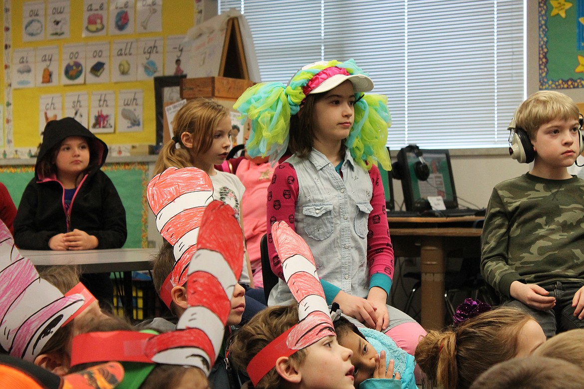 Charles H. Featherstone/Columbia Basin Herald
Students listen while Adam Munro reads &#145;Hop on Pop.&#146;