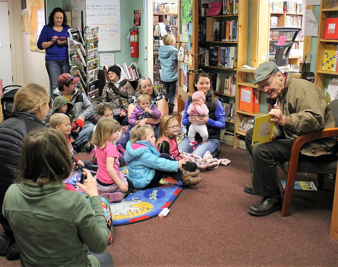 Superior resident Gordon Hendrick read Dr. Seuss books to a group of youngsters during storytime at the Mineral County Library on March 2. (Kathleen Woodford/Mineral Independent)