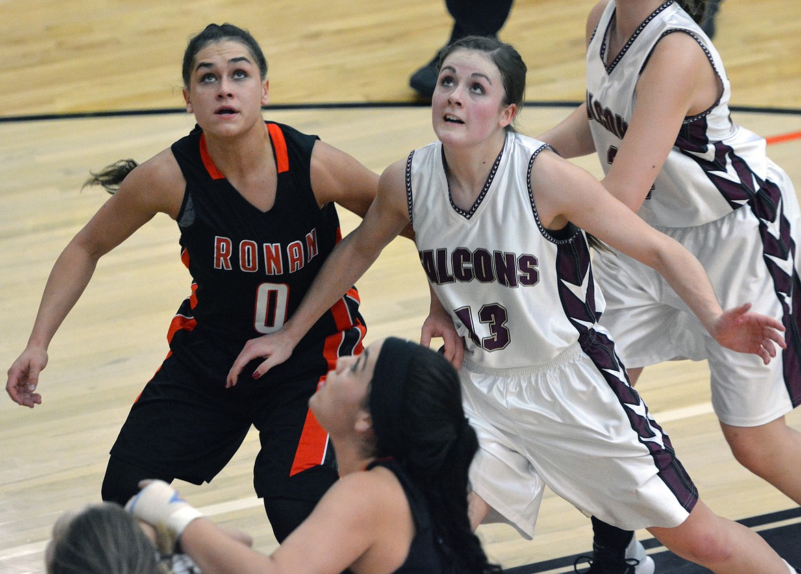 RONAN GUARD Micalann McCrea attempts to box out Florence-Carlton guard Autumn Round in the Western-B Divisional Championship game Saturday night at the Ronan Events Center. (Jason Blasco/Lake County Leader)