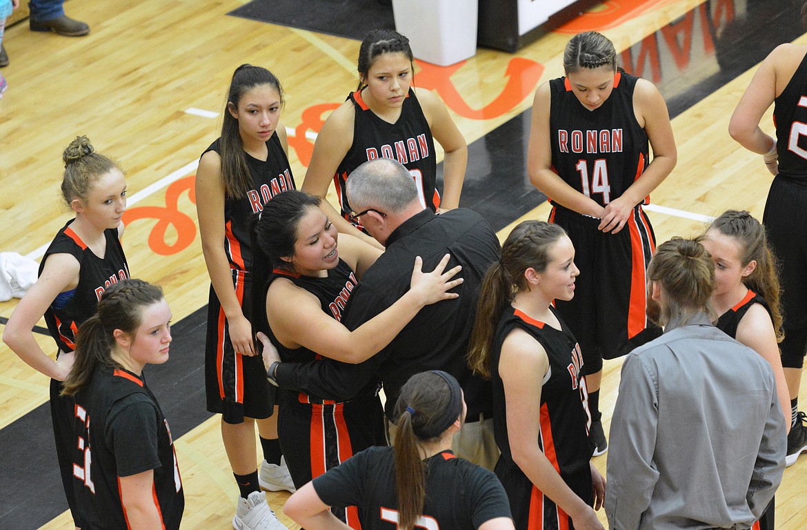 RONAN COACH Ron Hanson celebrates with Ronan Guard Kianna Finley after the Maidens captured the Western Class B Divisional Championship with a 64-55 victory over Florence-Carlton Saturday night at the Ronan Events Center. (Jason Blasco/Lake County Leader)