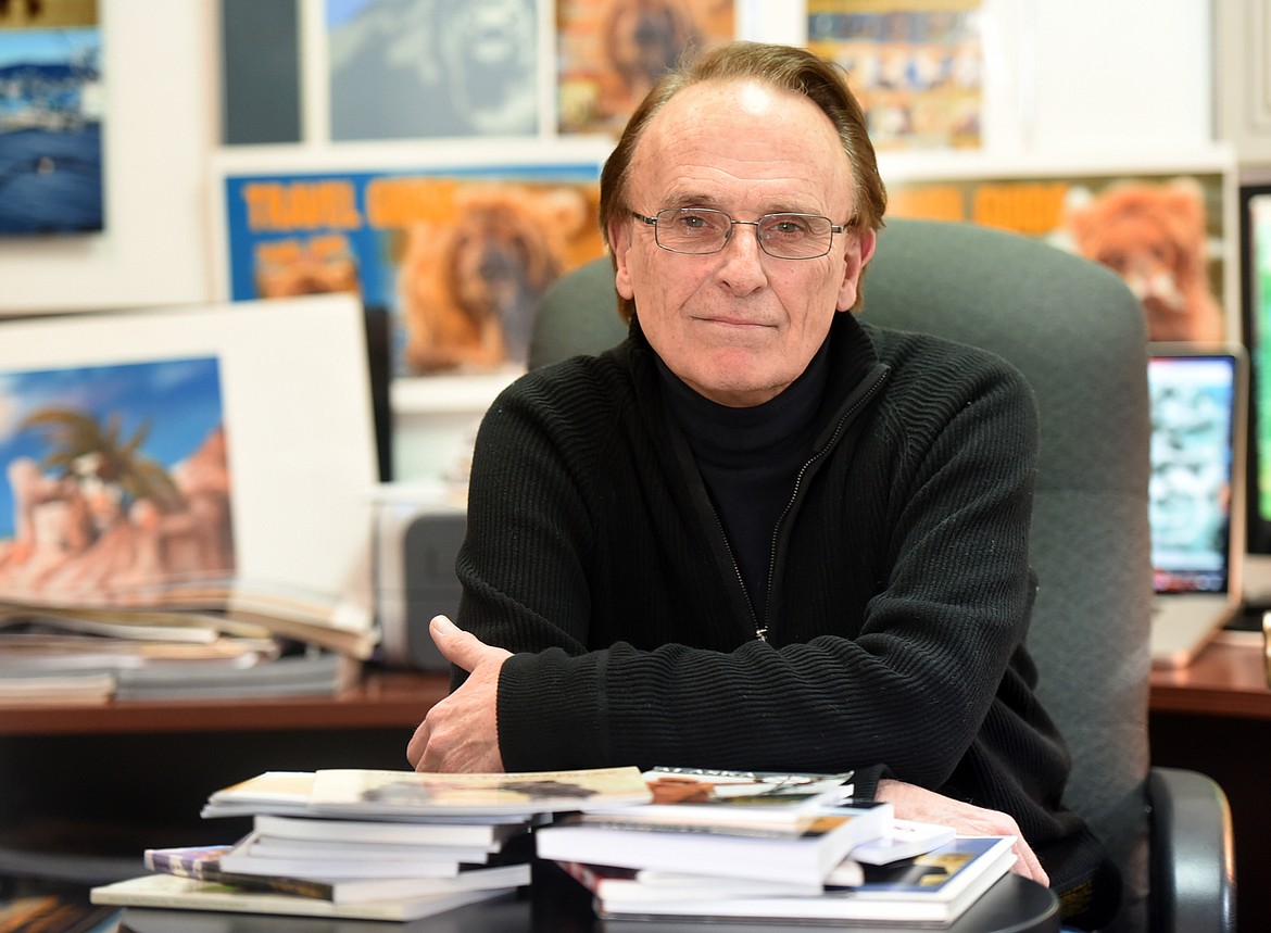 SCOTT GRABER of Scott Company Publishing sits in front of a stack of books he&#146;s helped published, on Monday, Feb. 27 at his Kalispell office. (Brenda Ahearn/This Week in the Flathead)