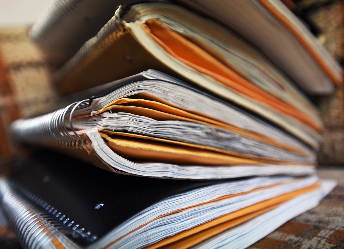 A STACK of pending projects sits in Scott Graber&#146;s office at Scott Company Publishing in Kalispell, Monday, Feb. 27.  (Brenda Ahearn/This Week in the Flathead)