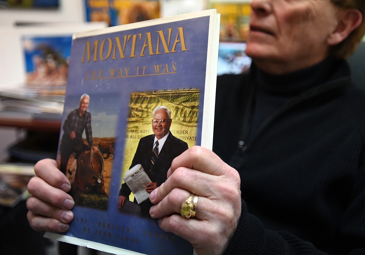 SCOTT GRABER of Scott Company Publishing holds up a book he helped publish.