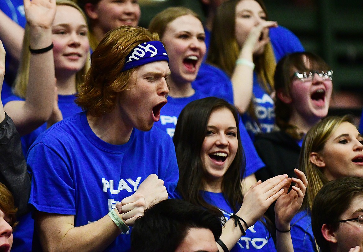 Band member Michael Hoerner and Keavyn Baker cheer on the Kats at the state tournament.