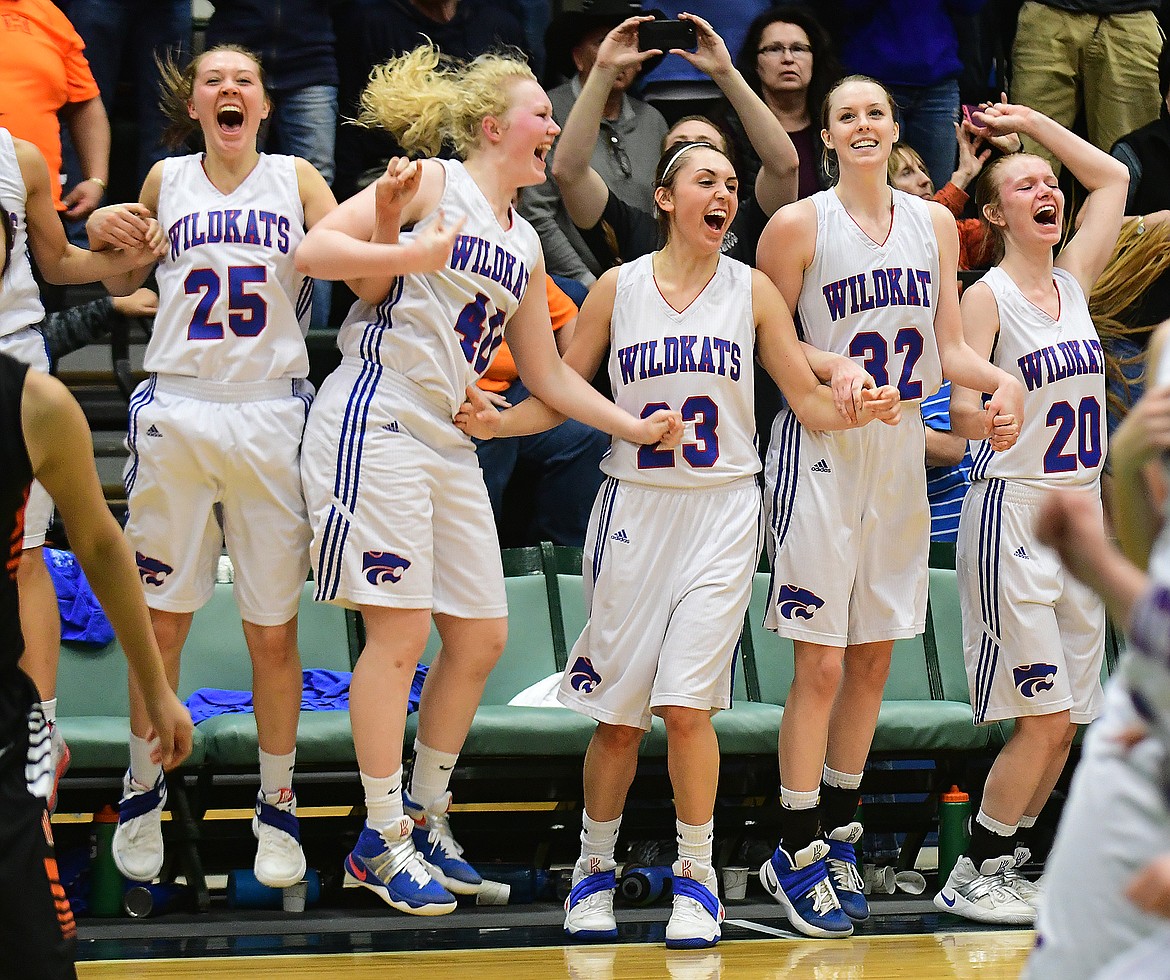 The Wildkats celebrate as time expires in the state A championship game in Butte Saturday. The Kats beat Hardin, 70-53 for their first title in 34 years. From left is Ryley Kehr, Sydney Hovde, Peyton Kehr, Kiara Burlage and Cydney Finberg.