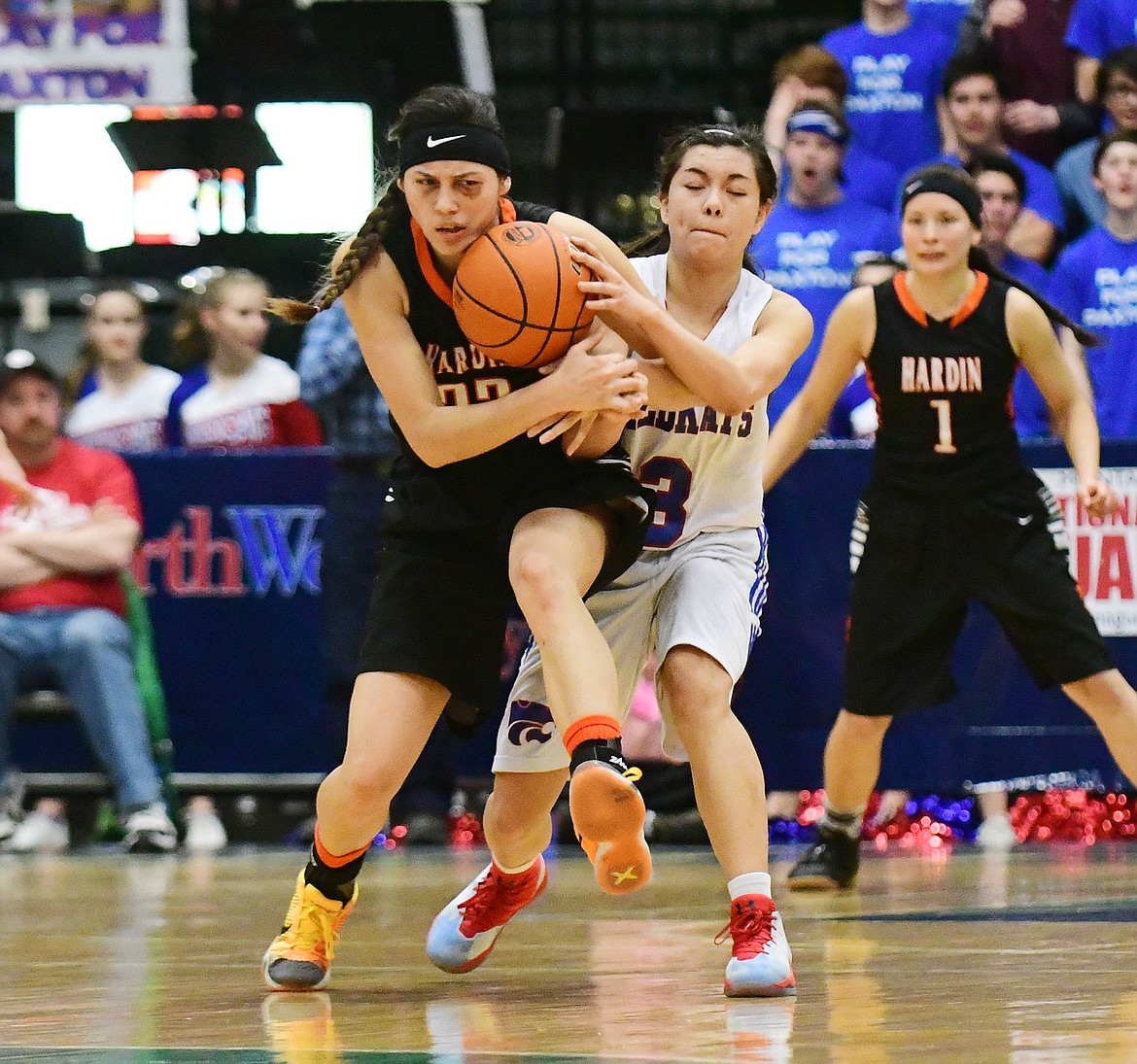 Dani Douglas, right, fights for possession against a Hardin defender.