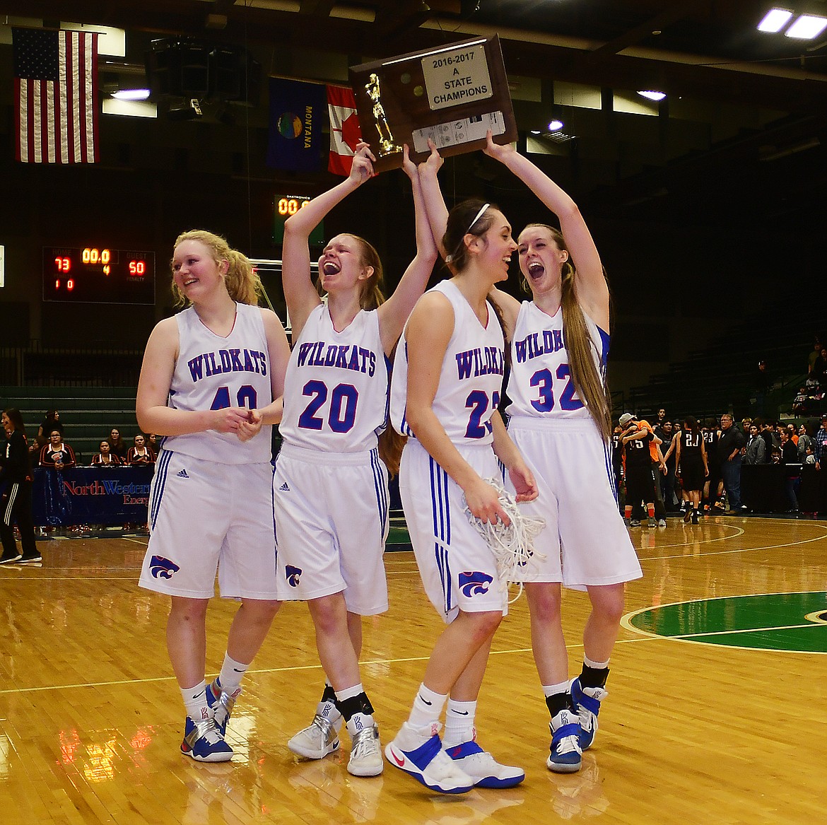 From left, Sydney Hovde, Cydney Finberg, Peyton Kehr and Kiara Burlage celebrate after winning the state A title.