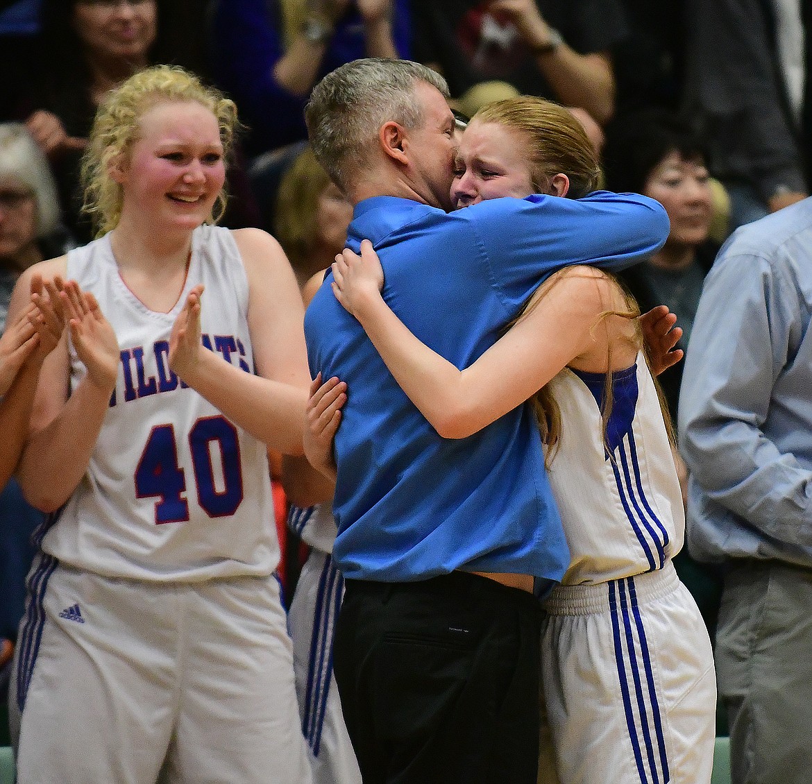 Coach Cary Finberg gives his daughter Cydney a big hug as the game wound down.