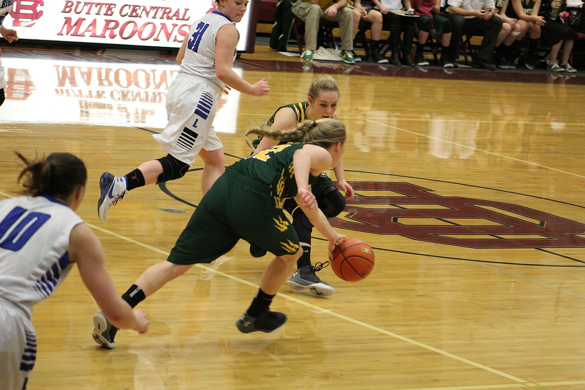 Emma Hill drives the ball to the basket during the Tigers game against Lone Peak during divisionals in Butte on Thursday. (Kathleen Woodford/Mineral Independent).