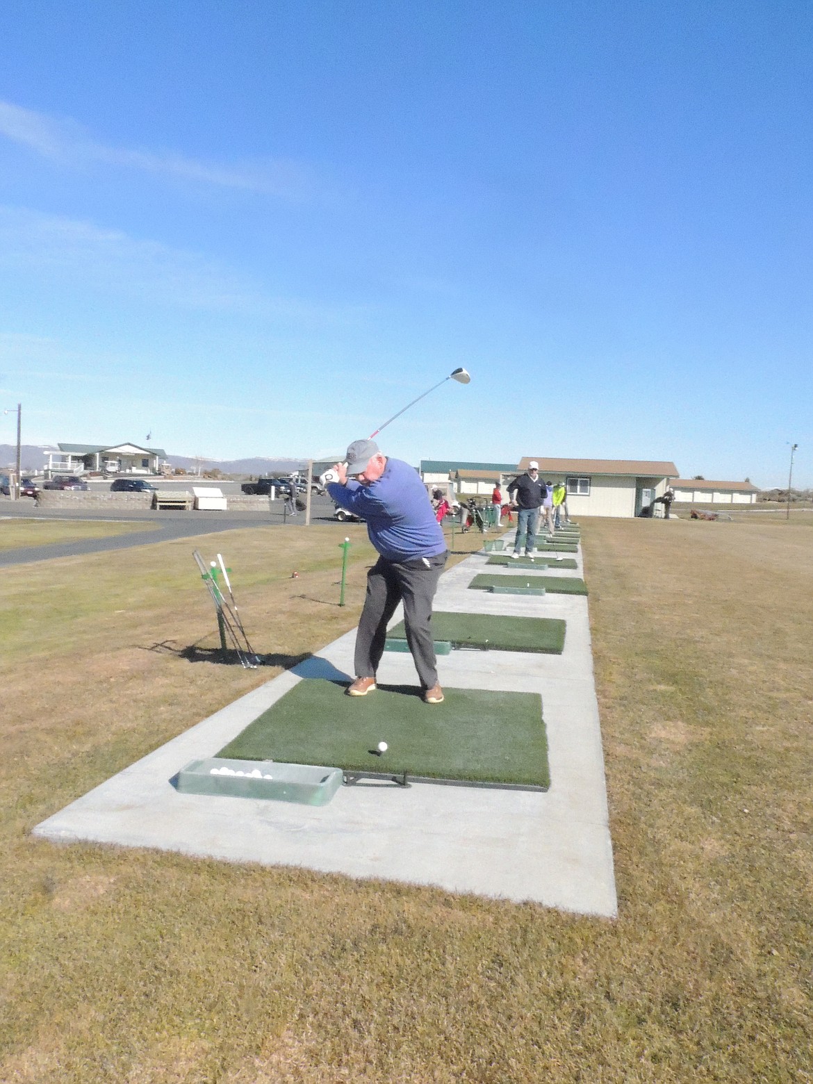 Rodney Harwood/The Sun Tribune - The golfers stretching their muscles and trying to shake off the winter doldrums at the Desert Aire driving range before the their first round of the year included players from Cle Elum, Ellensburg and Wenatchee.