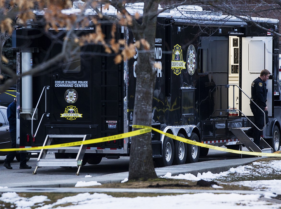 LOREN BENOIT/Press
A police officer exits the Coeur d&#146;Alene Police Command Center parked outside the Health Resources Center at Kootenai Health Wednesday afternoon after a woman was found dead inside a vehicle parked in the north lot of the hospital campus.