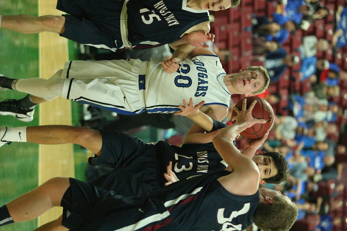 Rodney Harwood/Columbia Basin Herald
Warden senior Tanner Skone goes up for a rebound in traffic against King's Way Christian during Wednesday's 1A state play-in game at the Yakima SunDome.