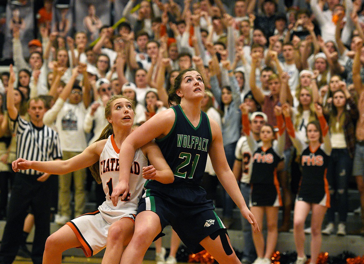 Flathead post Mary Heaton and Glacier post Nikki Krueger fight for a rebound during the crosstown game last week at Flathead. (Aaric Bryan/Daily Inter Lake)