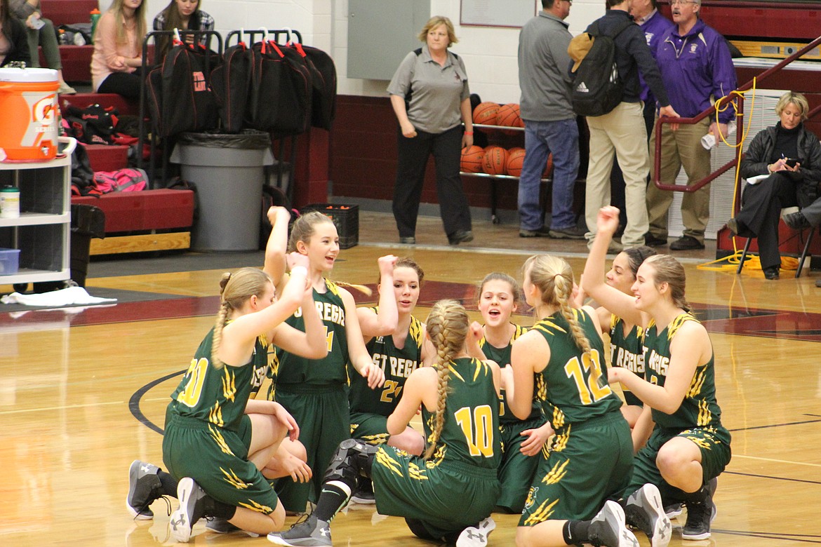 The St. Regis girls get fired up for their game against Lone Peak on Thursday in Butte. They lost 43-35. (Kathleen Woodford/Mineral Independent).