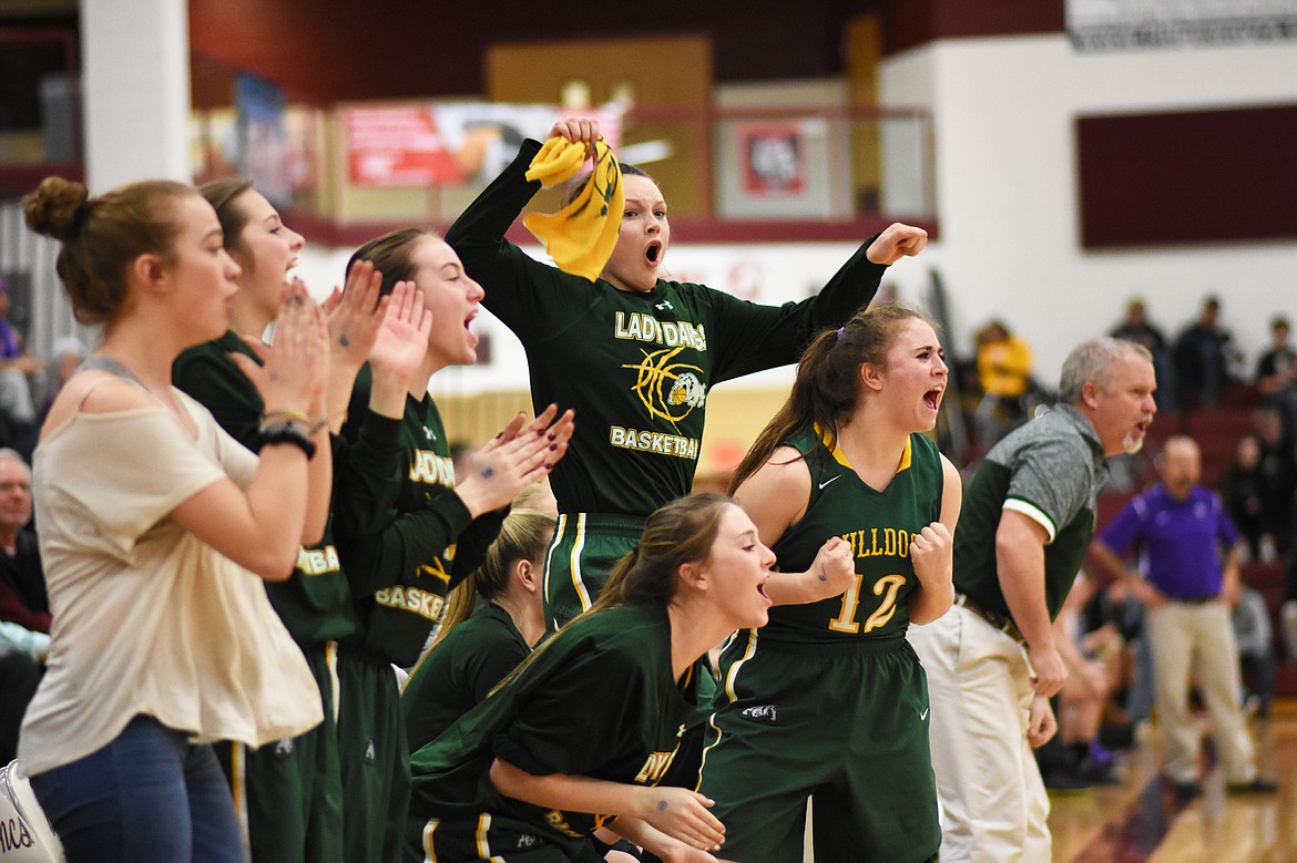 The Lady Bulldogs cheer on as the team grabs its first win of the season against Polson at the Western A Divisional Tournament in Hamilton. (Daniel McKay photos/Whitefish Pilot)