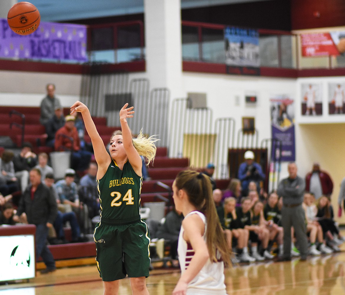 Diana Vasquez launches a jumper against Hamilton at the Western A Divisional Tournament in Hamilton.