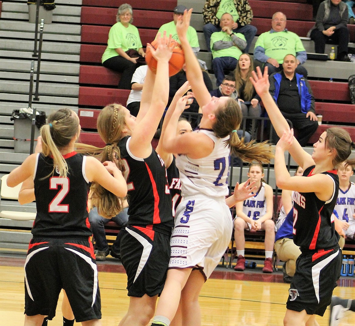 Cat Montanna Baughman fights for the ball against the Falcons during Thursday&#146;s matchup at divisionals. (Kathleen Woodford/Mineral Independent).