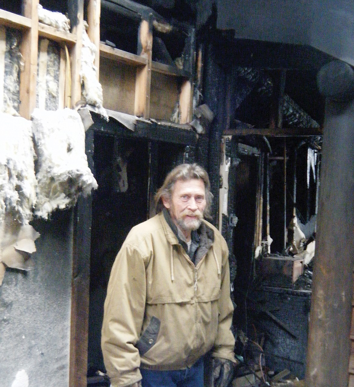 Charles 'Chuck' Curtis in the wreckage of his home at the Pine Tree Plaza in Troy. (Elka Wood/TWN)