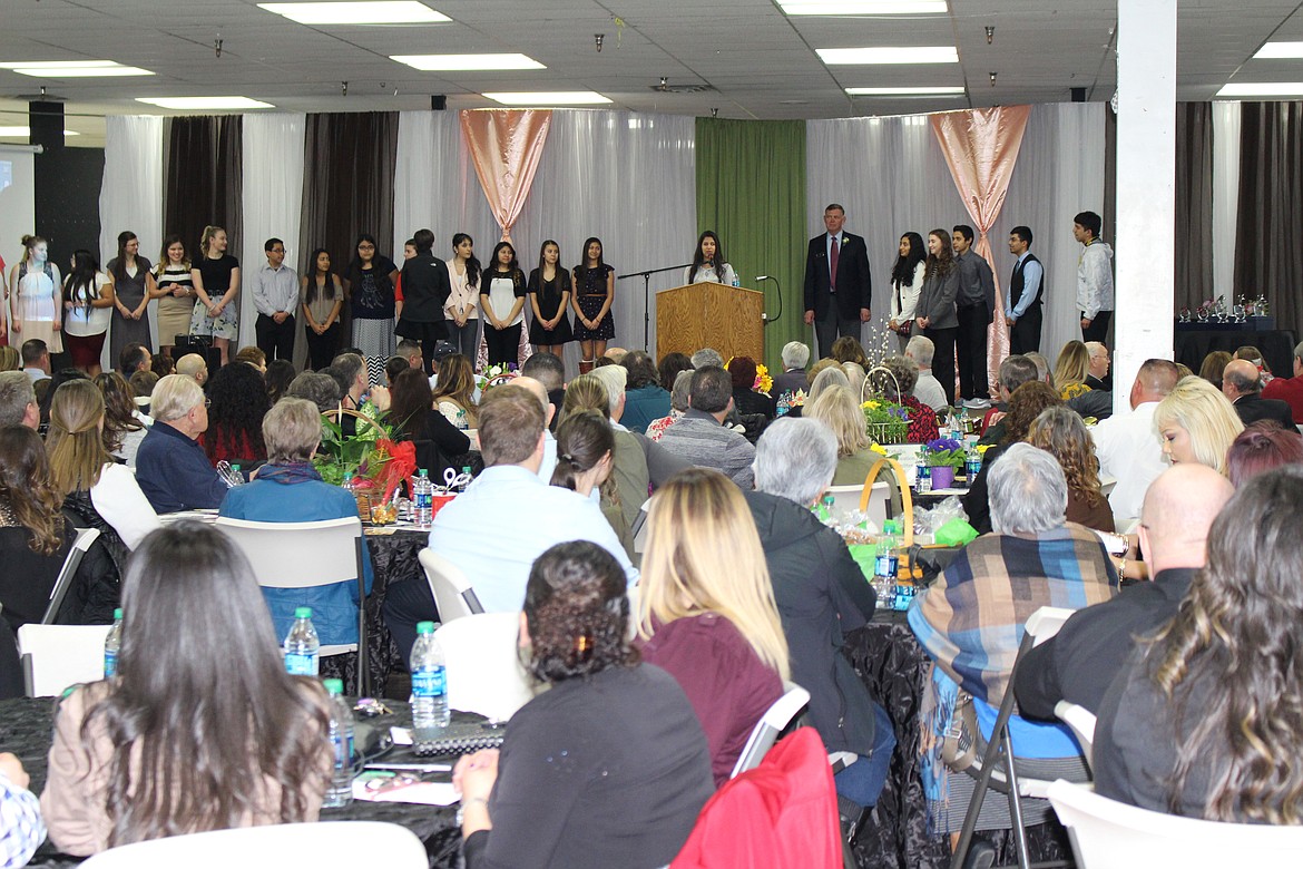 Chanet Stevenson/The Sun Tribune - All of the youth volunteers are brought on stage to introduce themselves.