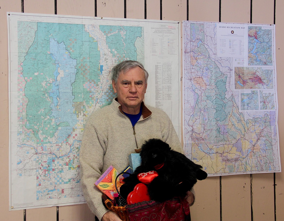 &#151;Photo by DAC COLLINS
Steven Russell, who helps some of the seniors at the Senior Center with their taxes in his spare time, poses with a gift basket that he won in this year's Friends of the Restorium's Valentine's Day Raffle.