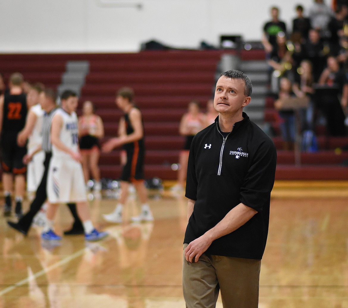 Coach Chris Finberg eyes the scoreboard as the Frenchtown-Columbia Falls game comes to a close at the Western A divisional tourney.