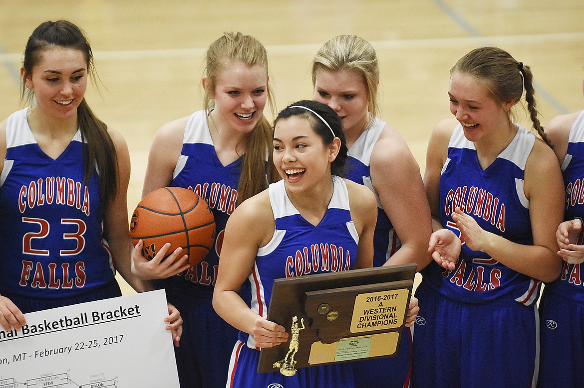 Dani Douglas, center is all smiles after the Wildkats won the Western A title Saturday. From left is Peyton Kehr, Cydney Finberg, Trista Cowan and Ryley Kehr.