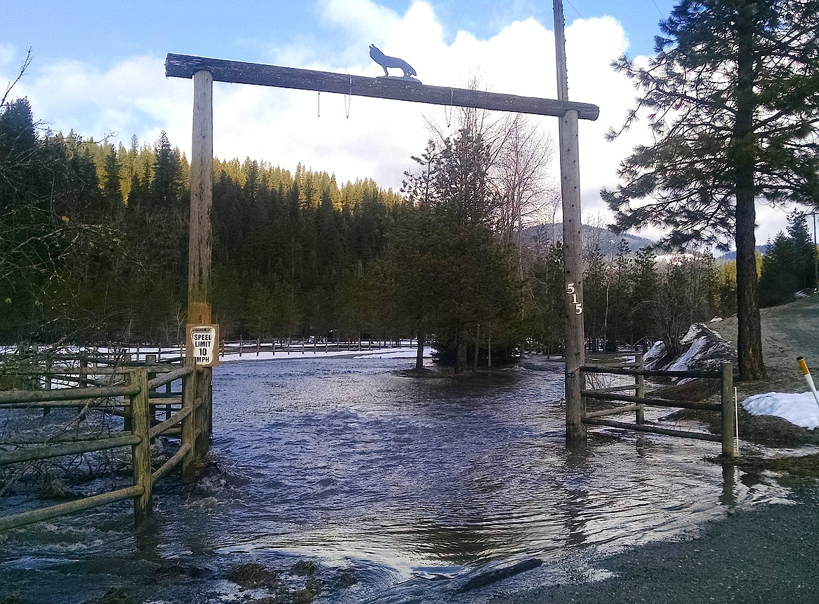 BRIAN WALKER/Press
Wolf Lodge Creek floods the entrance to a home on Wolf Lodge Creek Road on Thursday.