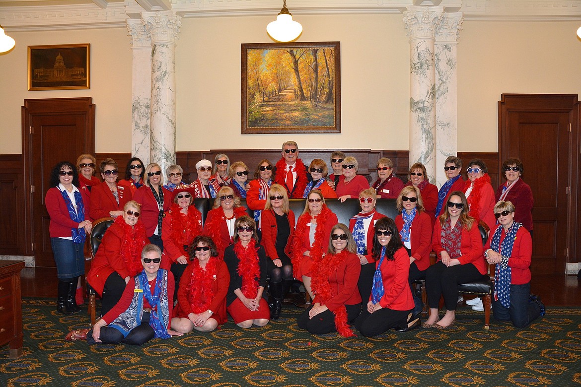 (Courtesy photo)
The Idaho Capitol was invaded by red-jacketed women as the Idaho Federation of Republican Women hosted its annual spring meeting Feb. 28-March 1. Above, the group get their picture taken with Idaho Gov. Butch Otter.