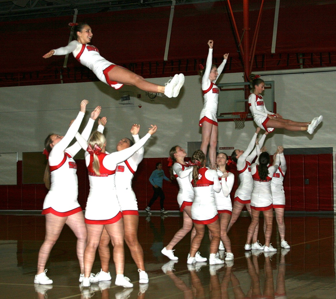 (Photo by ERIC PLUMMER)
The Sandpoint cheerleaders will be in action today during the 2017 Idaho State Dance Championships at the Ford Center in Nampa. The Bulldogs, who finished third in stunt group last season, will compete in the stunt group and show categories against 4A competition including Blackfoot, Canyon Ridge, Bishop Kelly, Minico, Lakeland, Skyview, Jerome, Preston, Skyline, Emmett, Burley, Pocatello and Idaho Falls. The team is coached by Lori Gedrose.