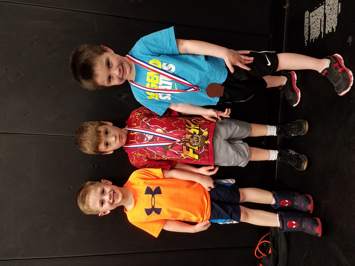 Courtesy photo
Team Real Life wrestlers, from left, Kaden Giovannini, Jacob Kunzi, 1st and Ashton Campbell, 3rd, participated in the Washington Little Guy Wrestling League tournament at North Central on March 4. The WLGWL was established to allow newer wrestlers to experience the sport in smaller venues and with fewer competitors. For more information on how to participate, contact Team Real Life, 660-8579.