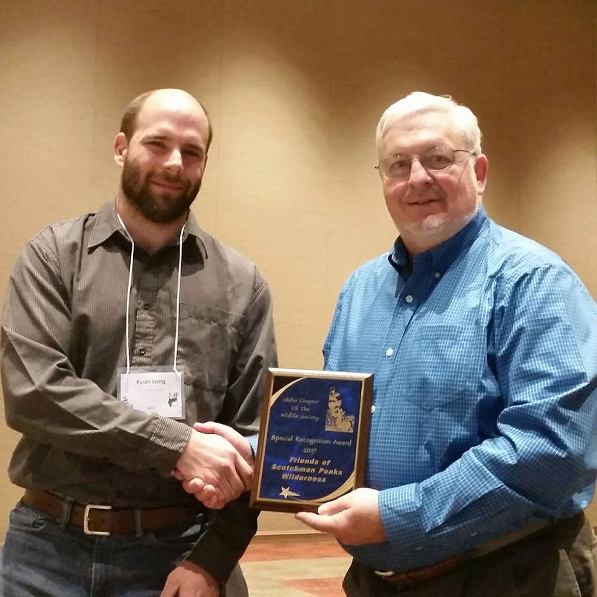 (Courtesy photo)
Friends of Scotchman Peaks executive director Phil Hough accepts the Idaho Chapter of the Wildlife Society 2017 Special Recognition Award from ICWS Awards Chairman Ryan Long on March 2 in Boise.