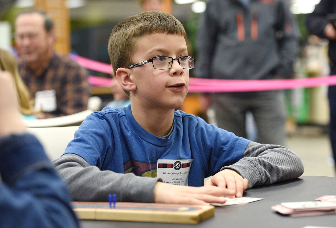 Lakeside fourth-grader Will Wendle puts down his cards during the final round.