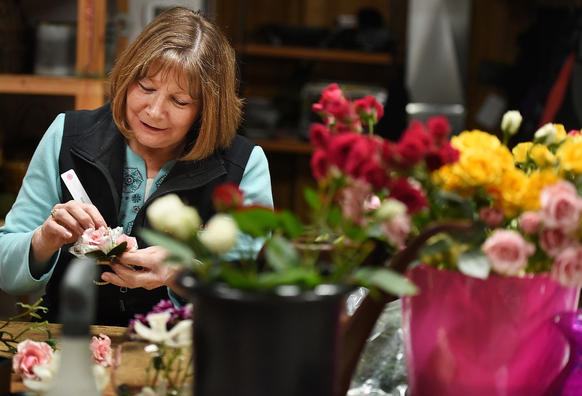 Gloria Hanson making corsages on Thursday, March 16, at Flowers by Hansen in preparation for prom weekend in the Flathead. Flowers by Hansen has already sold more than 150 corsages for the weekend and if last year&#146;s trend continues they&#146;ll sell a few dozen more today. (Brenda Ahearn/Daily Inter Lake)