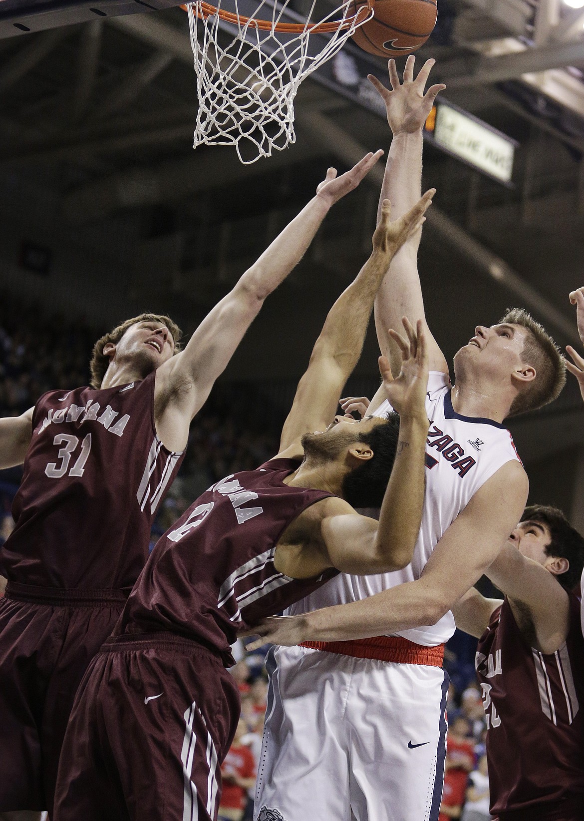 Gonzaga&#146;s Ryan Edwards, right, tips in a shot while defended by Montana&#146;s Jack Lopez (31) and Martin Breunig (12) during an NCAA basketball game last season in Spokane, Wash. Edwards, a Glacier High graduate, has been a member of the some of the best and most successful teams in Gonzaga history, and will look to help the Bulldogs to another deep run in the NCAA men&#146;s basketball tournament starting this weekend. (AP Photo/Young Kwak, File)