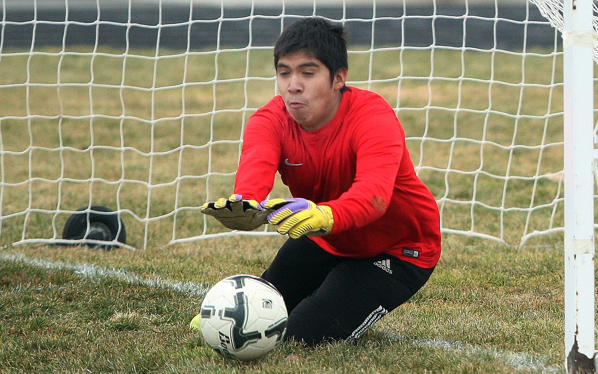 Rodney Harwood/The Sun Tribune - Othello goaltender George Navarrete makes a save during Saturday's season opener against Naches Valley at Husky Stadium. Othello won 8-0.