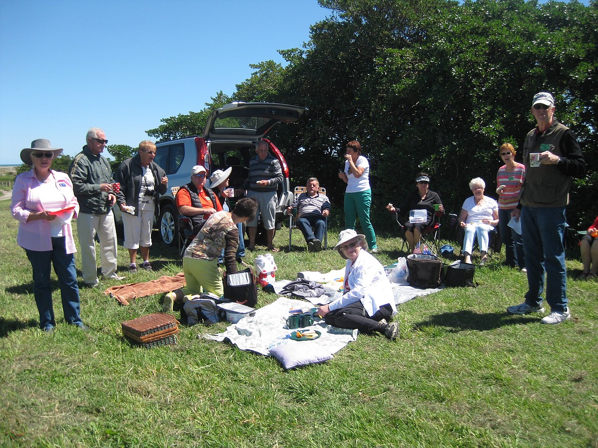 Carol Beaudion of Kalispell, sitting in the center, enjoys a picnic with Friendship Force club members in Levin, New Zealand. Joyce Hrouda, also of Kalispell, pictured third from the left. (Photo courtesy of Carol Beaudion)