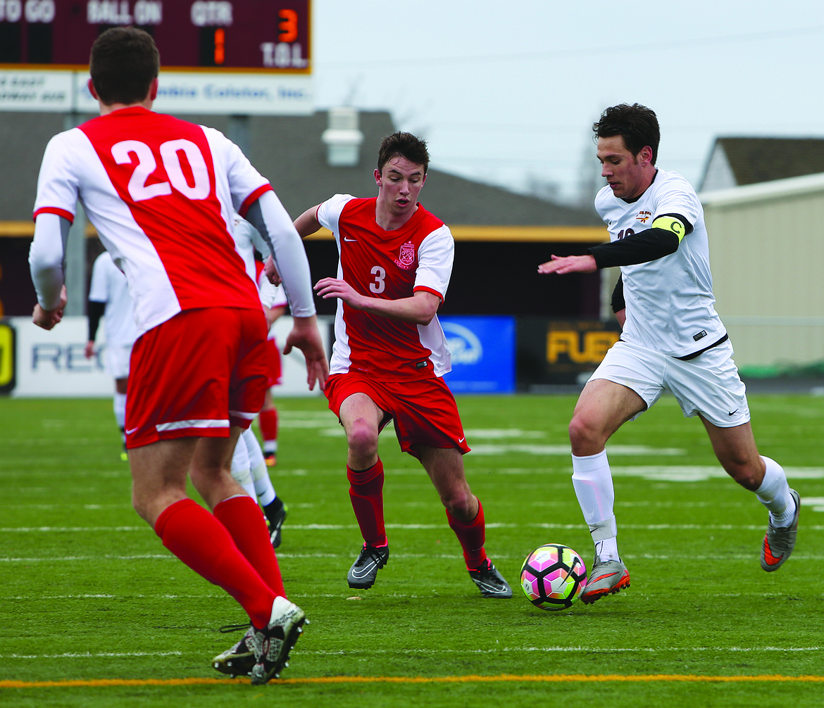 Connor Vanderweyst/Columbia Basin Herald
Moses Lake's Daniel Sinchuk dribbles the ball up the field Saturday at Lions Field.