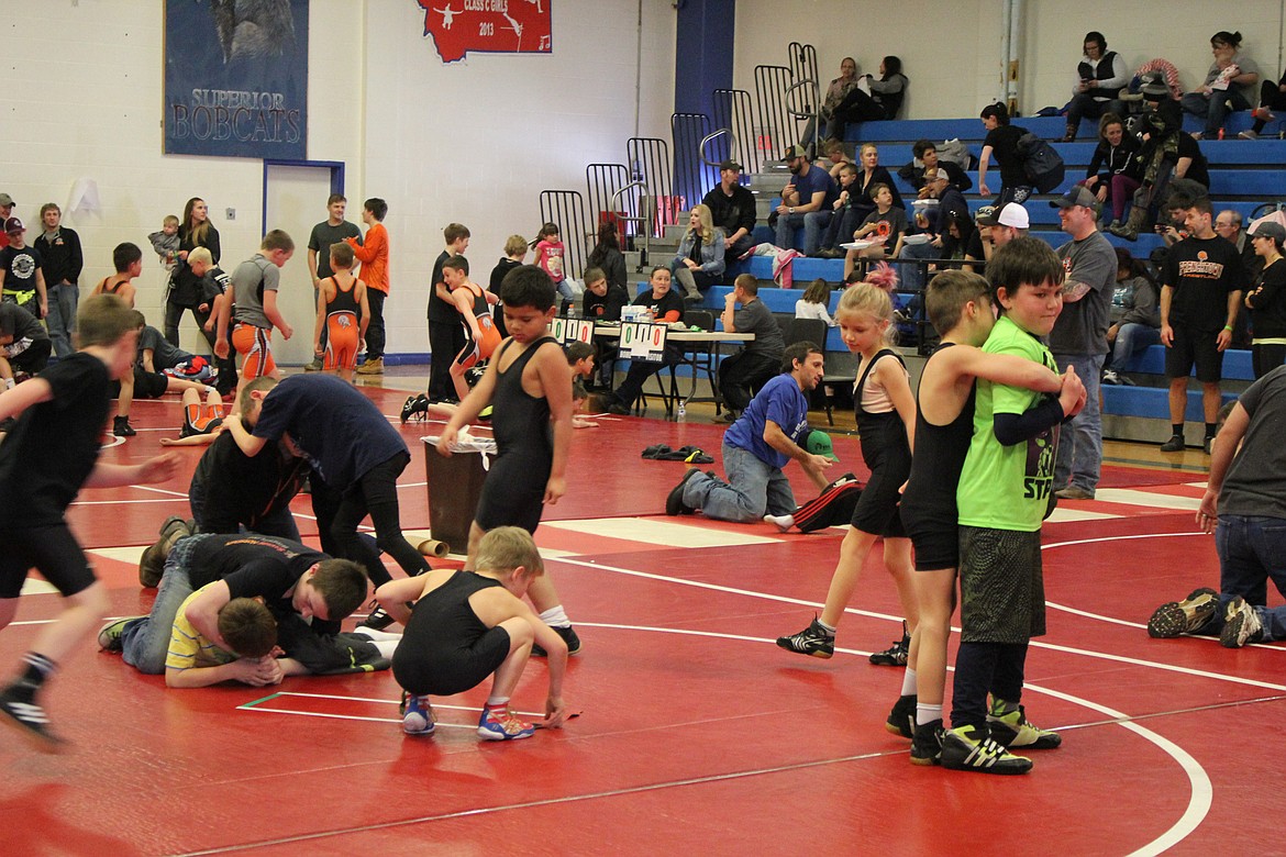 Plains Little Guy Wrestlers warm up in the Superior gym Saturday, March 11.