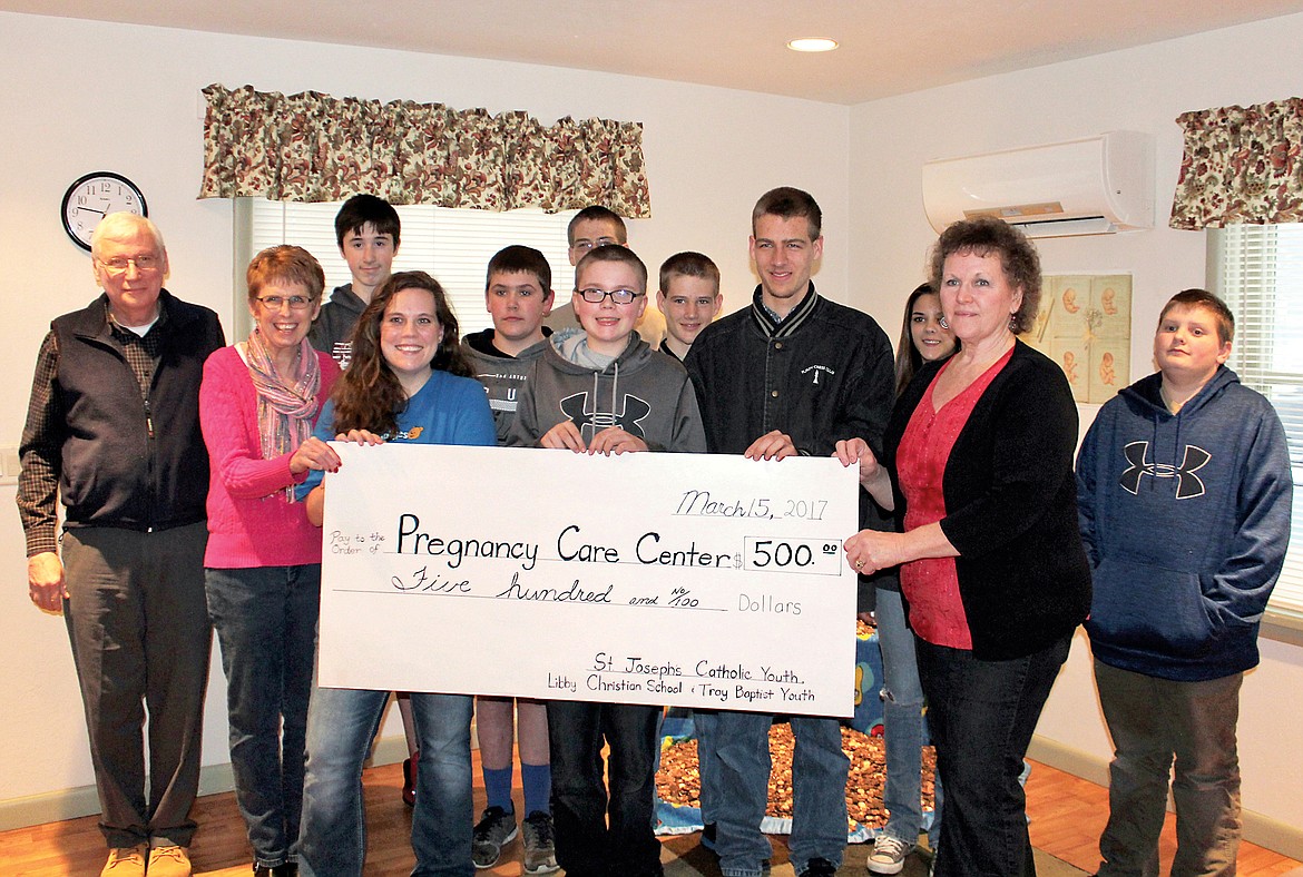 Youth Group members from Libby, Troy and the Yaak donate the profits from their penny awareness project to the Pregnancy Care Center.