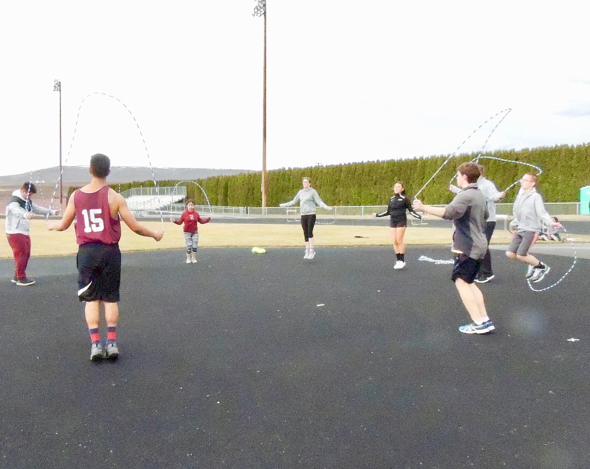 Ted Escobar/The Sun Tribune - The throwers (shot put, javelin, discus) use jump ropes to work on flexibility and foot control.