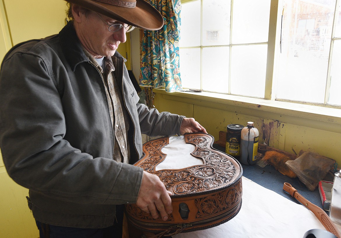 Jeff Morrow holds the guitar case he made for Canadian artist Corb Lund. (Aaric Bryan/Daily Inter Lake)