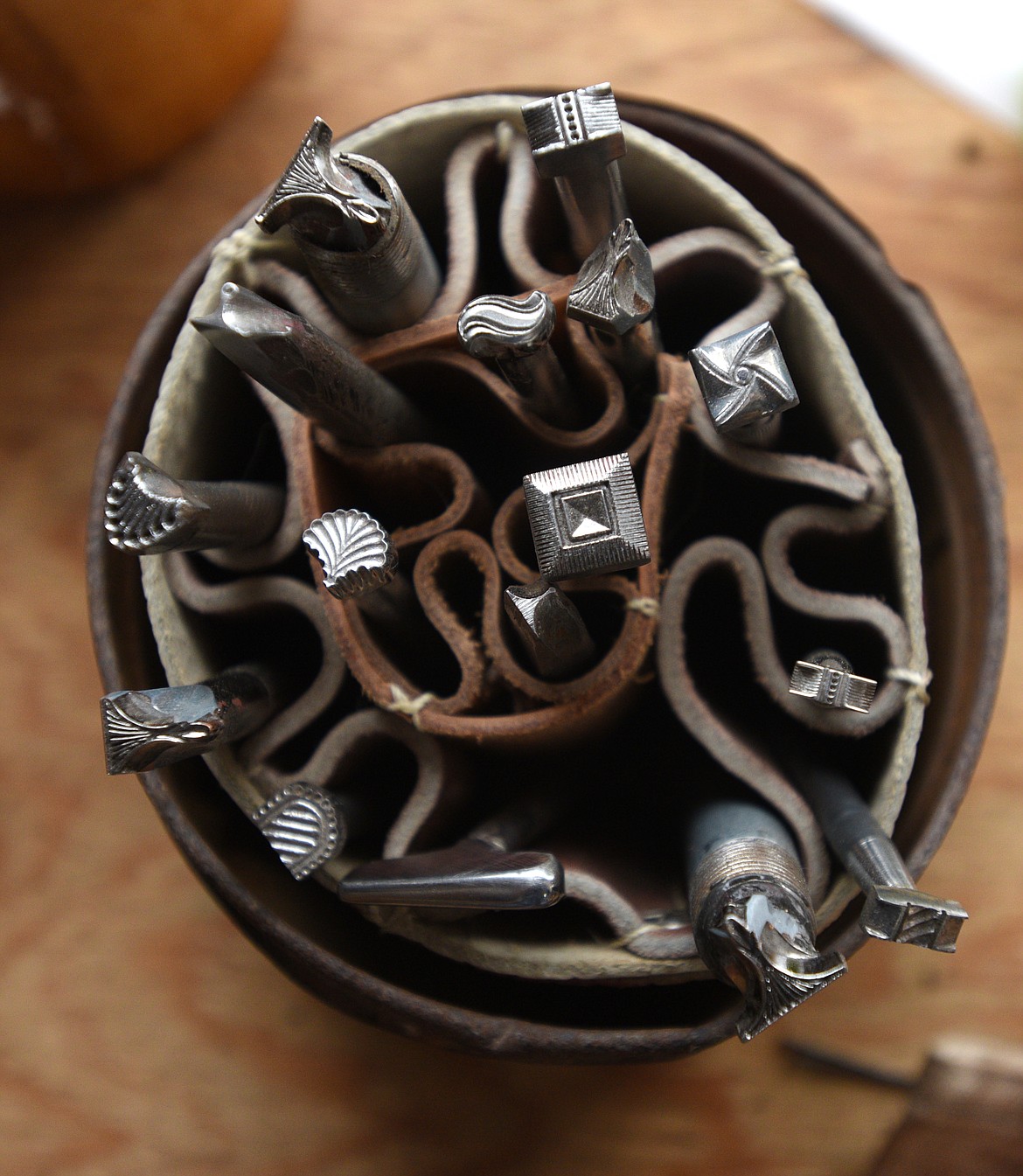 Stamps used to make designs in leather sit on a workbench. (Aaric Bryan/Daily Inter Lake)