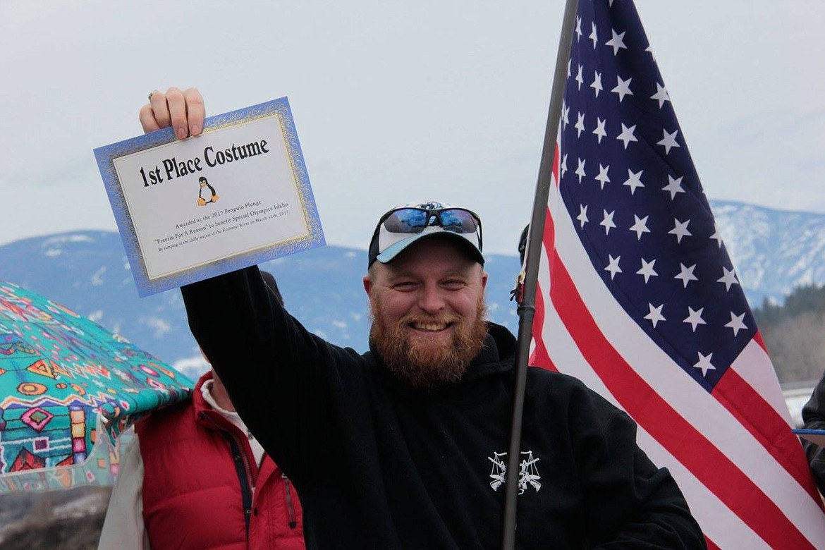 &#151;Photo by KRAMER PHOTOGRAPHY
Tom Chaney wins first place for his American spirit costume at the 2017 Special Olympics Penguin Plunge.